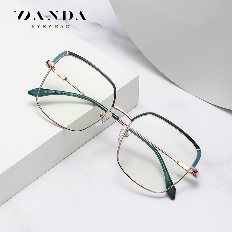 Nueva tendencia gafas marco de metal femenino de dos colores espejo plano JS8617 patada piernas tirachinas con miope anti-luz azul