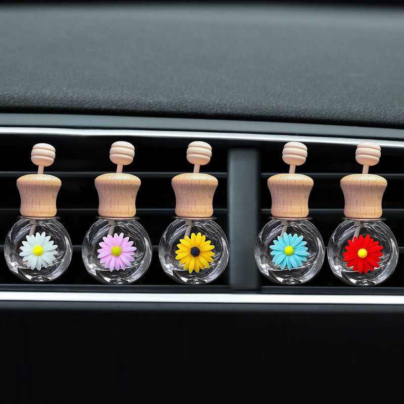 Pequeña margarita salida de aire botella de perfume de coche botella vacía flor de sol botella de aromaterapia de coche decoración de coche creativo