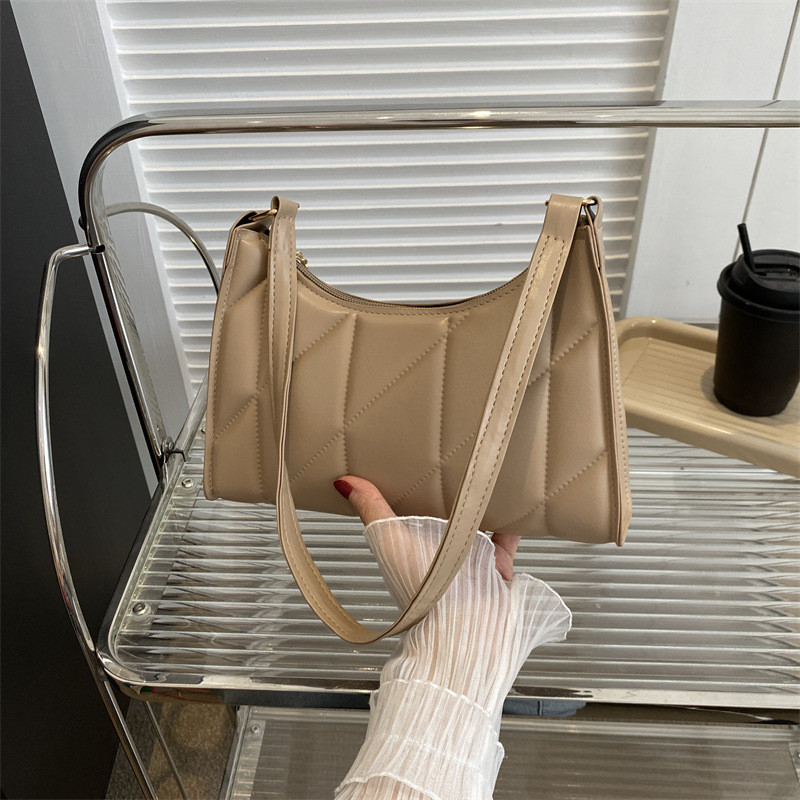 2023 verano nueva moda Moda retro textura bolsa de axilas simple bolsa de palo francés bolsa de hombro Portátil Bolsa de las mujeres