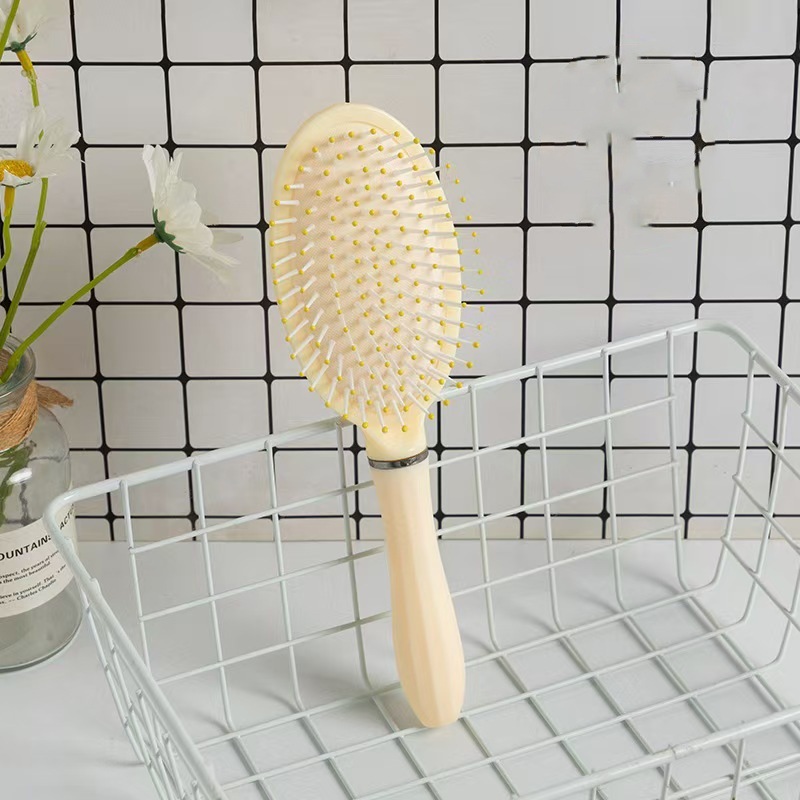 Peine de colchón de aire amarillo de 4 piezas Peine de costillas esponjosas Peine portátil de alto valor Peine suave para el cabello Peine de masaje doméstico