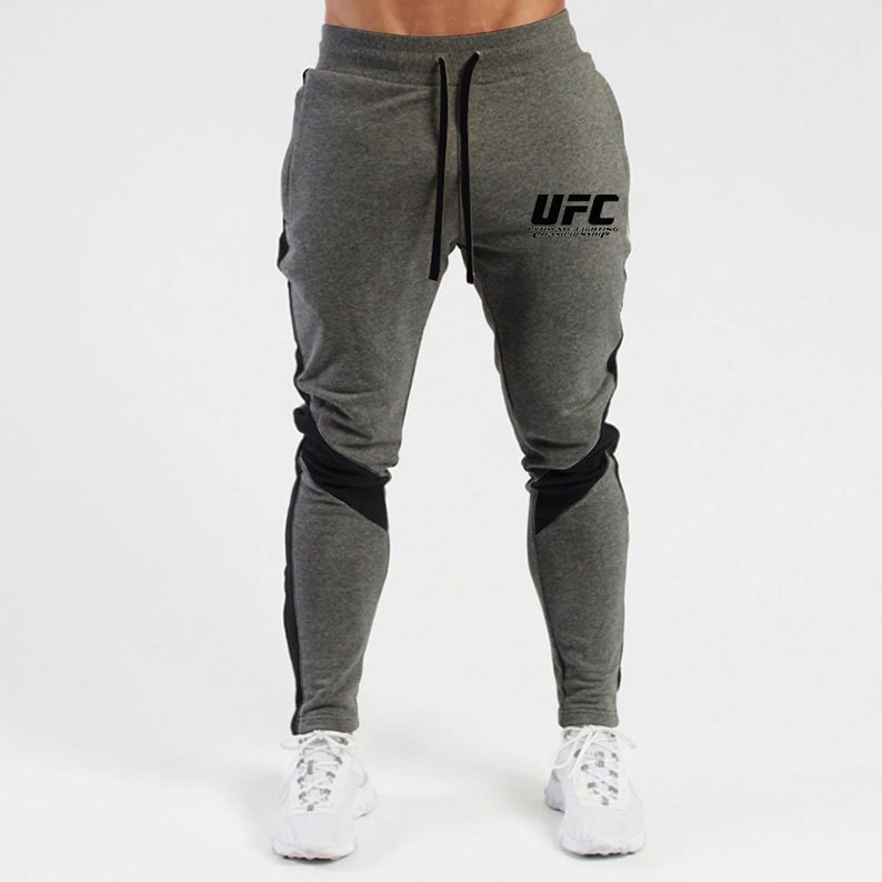 Otoño e invierno letras deportivas juventud ordinaria media elástica Mediados de cintura pantalones de algodón negro en stock moda de lana pantalones de los hombres