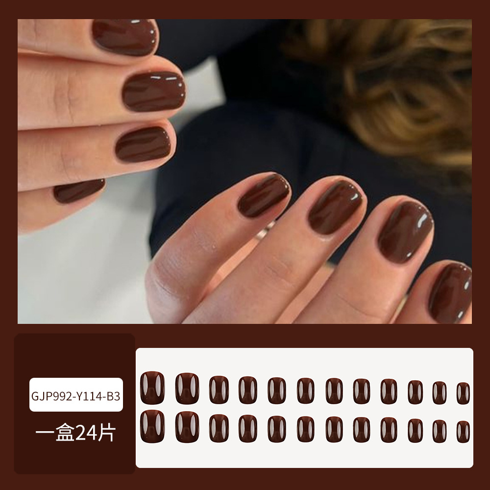 Ventas transfronterizas calientes de uñas marrón oscuro temperamento de la atmósfera corta 24 piezas de uñas falsas de color sólido terminadas