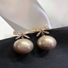 Advanced earrings from pearl with bow, demi-season silver needle, french style, high-quality style, light luxury style