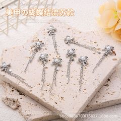 新しいネットの赤い8つのドリルの合金の蝶結びのフリンジの金のネイルは甲のアクセサリの爪の装飾品のdiyを装います。