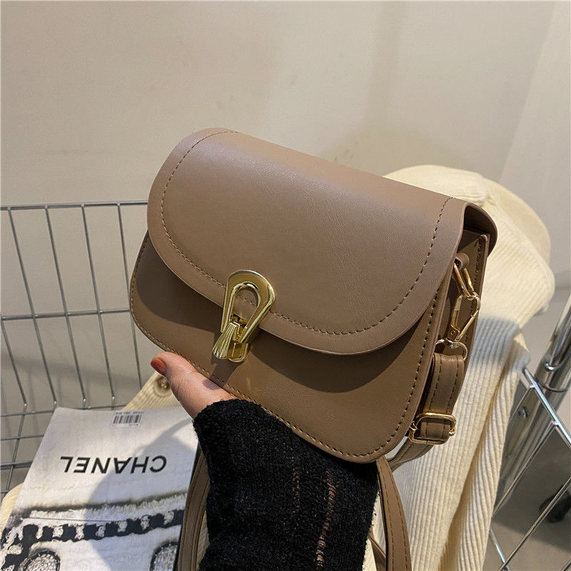 シンプルな質感の小さいカバンの女性の新型の夏のファッションの通勤の斜めのショルダーバッグの洋風の百合のロックのショルダーバッグの卸売り|undefined