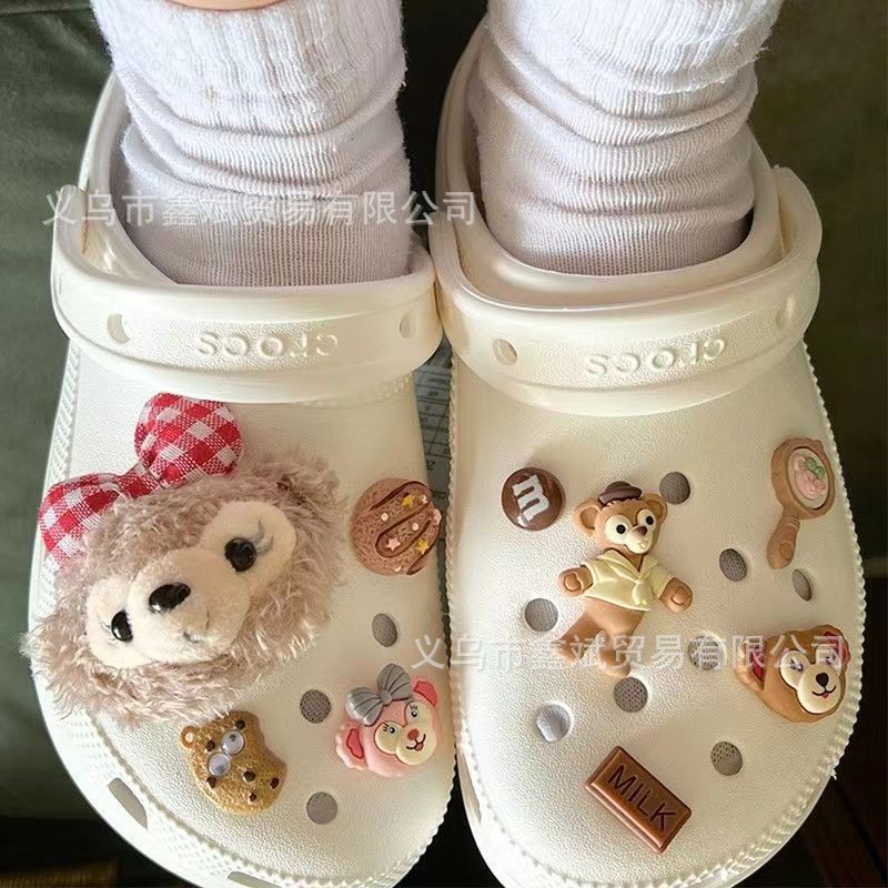 Muñeca de dibujos animados felpa estrella Delu agujero zapatos accesorios piel bola creativa nuevos zapatos decorativos hebilla agujero zapatos Accesorios