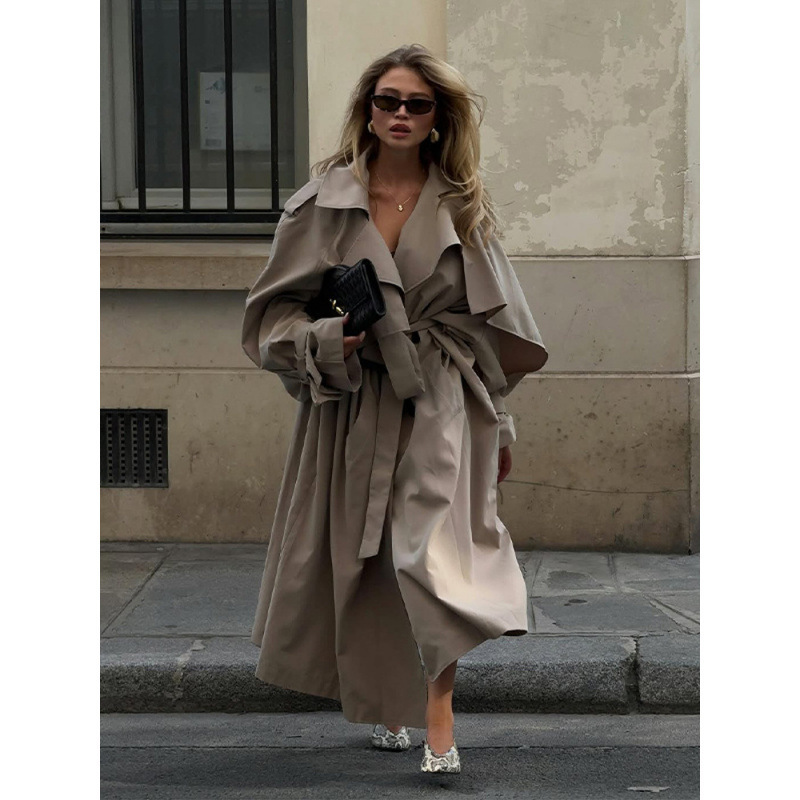In-Stock Elegant Solid Color Cape-Sleeve Long Trench Coat for Women 2025 Cross-Border European and American Style Autumn New Hot-Selling Item In-Stock Elegant Solid Color Cape-Sleeve Long Trench Coat for Women 2025 Cross-Border European and American Style Autumn New Hot-Selling Item