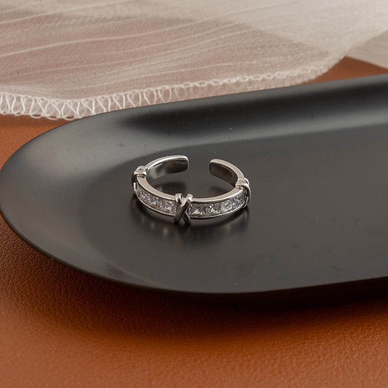 Ring with stone with letters with zircon