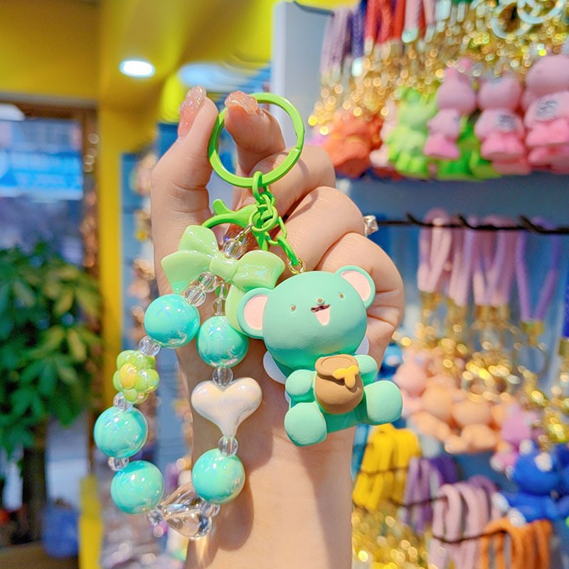 Creativo lindos cuentas miel osos coches mochilas de automóviles para hombres y mujeres parejas pequeños regalos colgantes de llaveras al por mayor