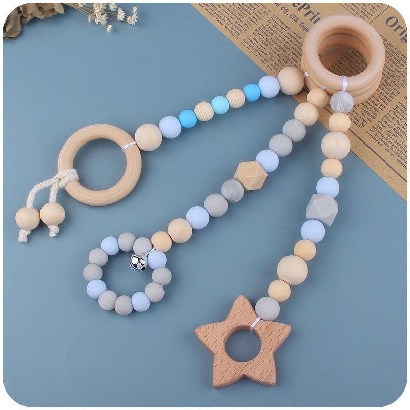 Nuevo Bebé calmante juguetes traje bebé cuentas de silicona haya molares mordedor juguetes pequeña campana Amazon