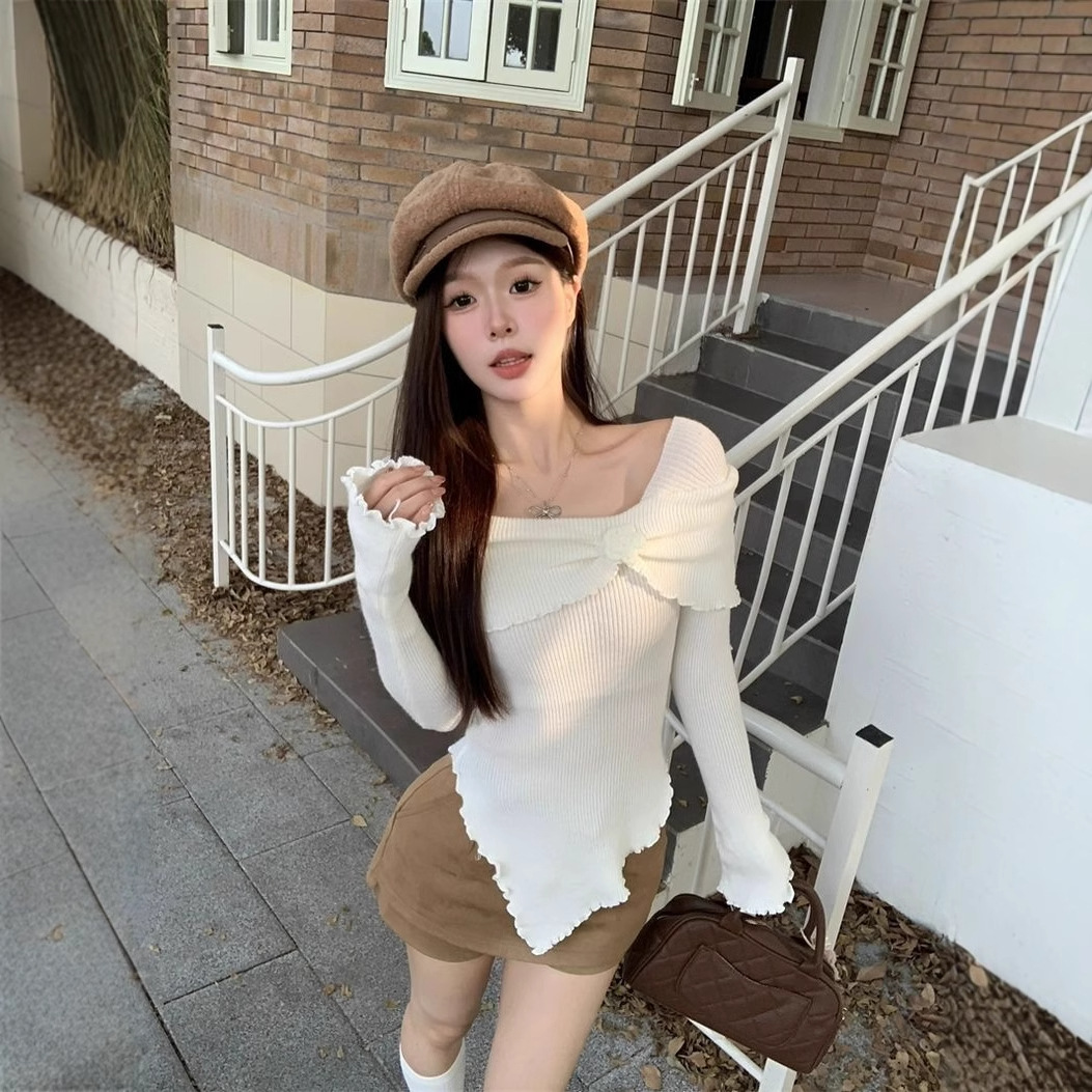 フランス風の気質の木の耳元の立体的な花の一字の肩のニットの上着の修身のセーターの底のシャツの女性は秋冬を掛けます。