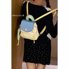 韩国纽扣奶黄双肩包包女式2025新款潮时尚撞色背包百搭手提水桶包