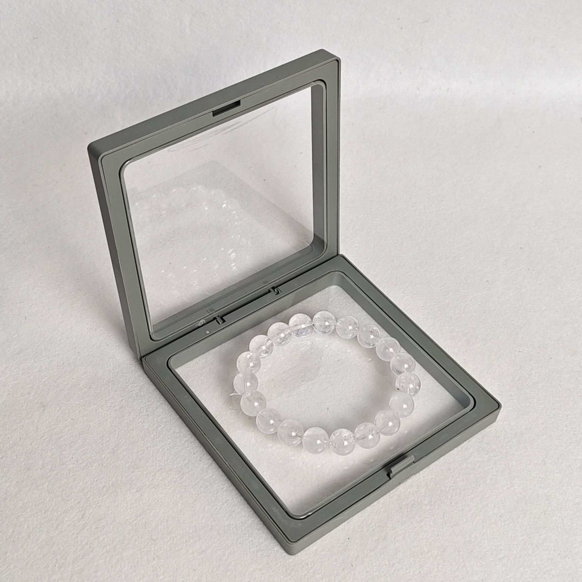 Gray pe film box; length and width 9*9cm, thickness 2cm