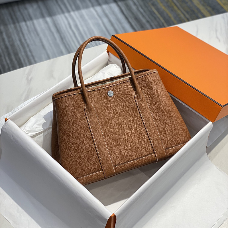 2023 Nueva bolsa de mensajero de hombro de las mujeres de cuero genuino bolso de mano bolsa de jardín portátil bolsa grande bolsa de compras bolsa de cubo