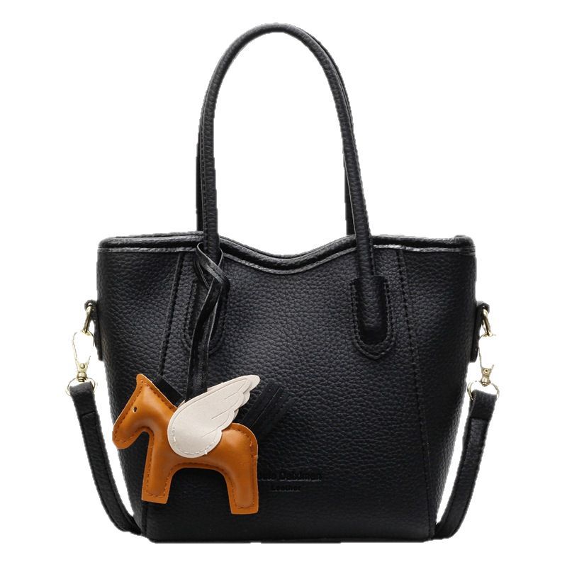 Bolsa de cubo portátil de estilo occidental de alta calidad para mujer 2025 nuevo bolso de mensajero de hombro de viajero de estilo explosivo de moda salvaje