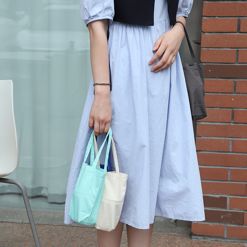 Bolso de taza portátil fresco bolso de Corea del Sur bolsa de lona Portátil Bolsa de cosméticos para niñas bolsa de almacenamiento de embrague