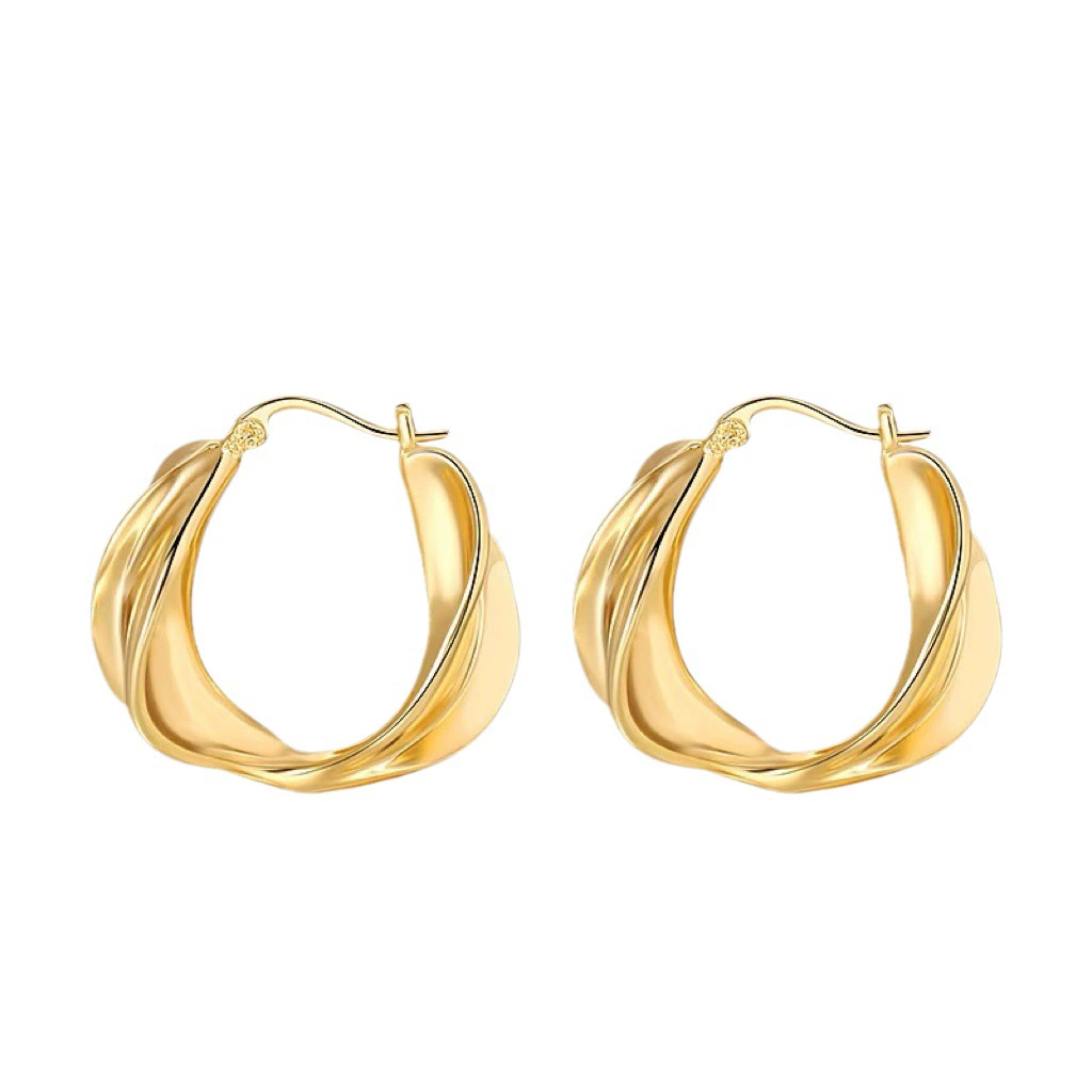 Golden metal small design earrings, trend of season