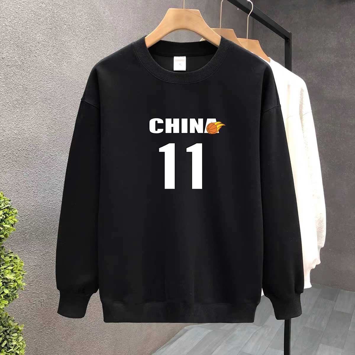 Suéter de algodón negro pesado de alta gama para mujeres 2025 otoño y invierno nuevo estilo europeo y americano camiseta de manga larga fondo suéter de estudiante