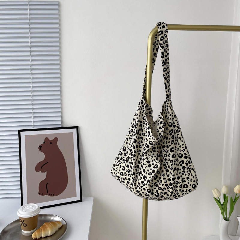 Diseño nicho bolsas de lona para mujeres 2025 nueva gran capacidad coreana estampado de leopardo flor de hombro impresa bolsas de mujer