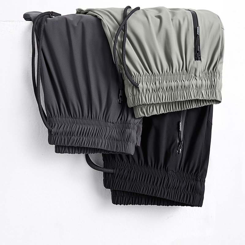 2025 verano pantalones deportivos de talla grande pantalones de hombre pantalones de aire acondicionado pantalones de seda de hielo de secado rápido pantalones de pierna recta gorda al por mayor