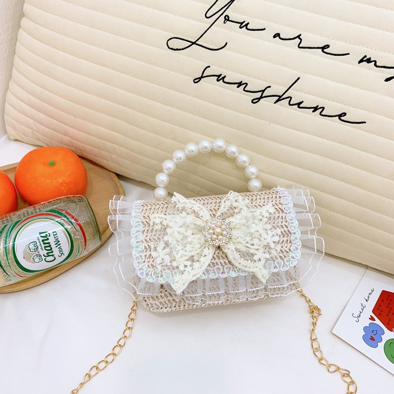 2025 nuevo regalo para niñas para niñas jardín de infantes Día de los niños arco de perla tela de paja bolso de hombro