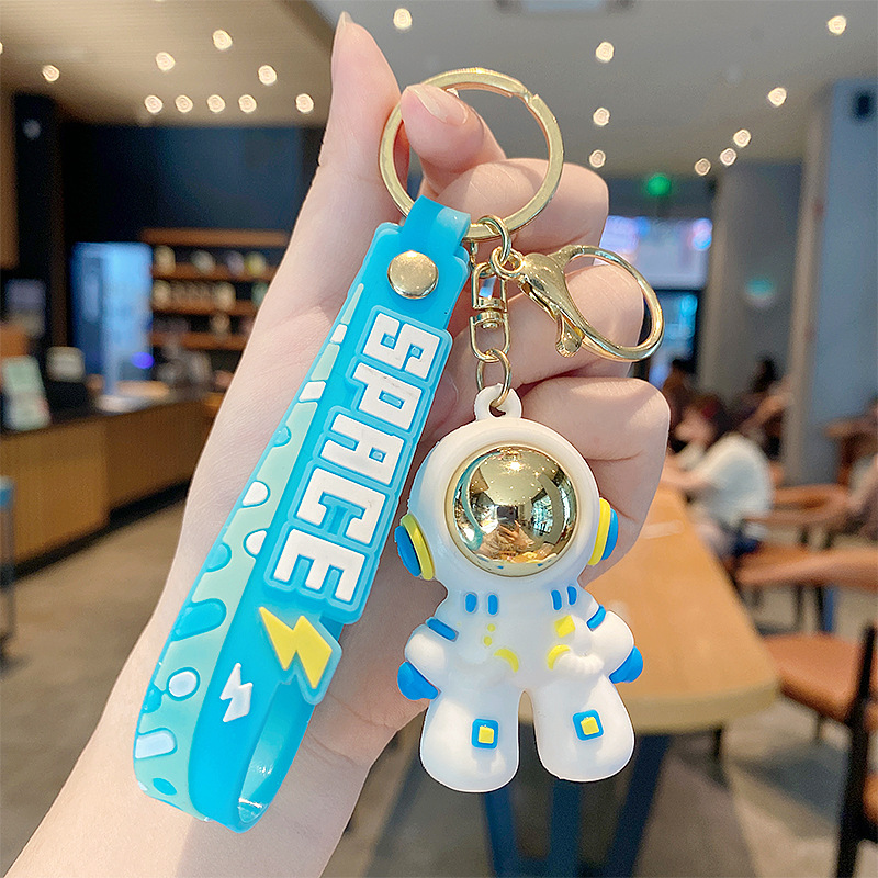 Dibujos animados cosmonauta astronauta astronauta muñeca llavero accesorios de automóvil creativos lindo bolso de pareja colgante regalo