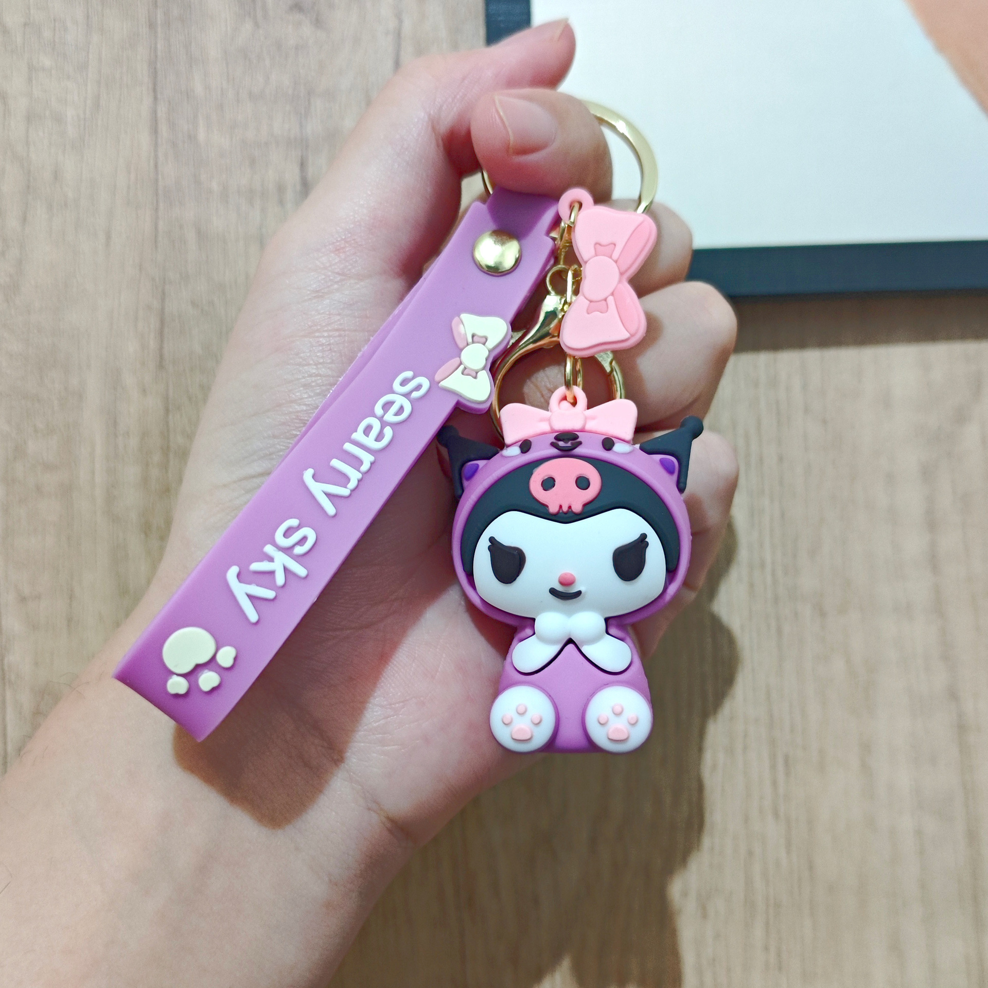 Perro de orejas grandes Melody KT gato pudín perro Kolomi caricatura de silicona llavero colgante bolsa colgante caja ciega regalo