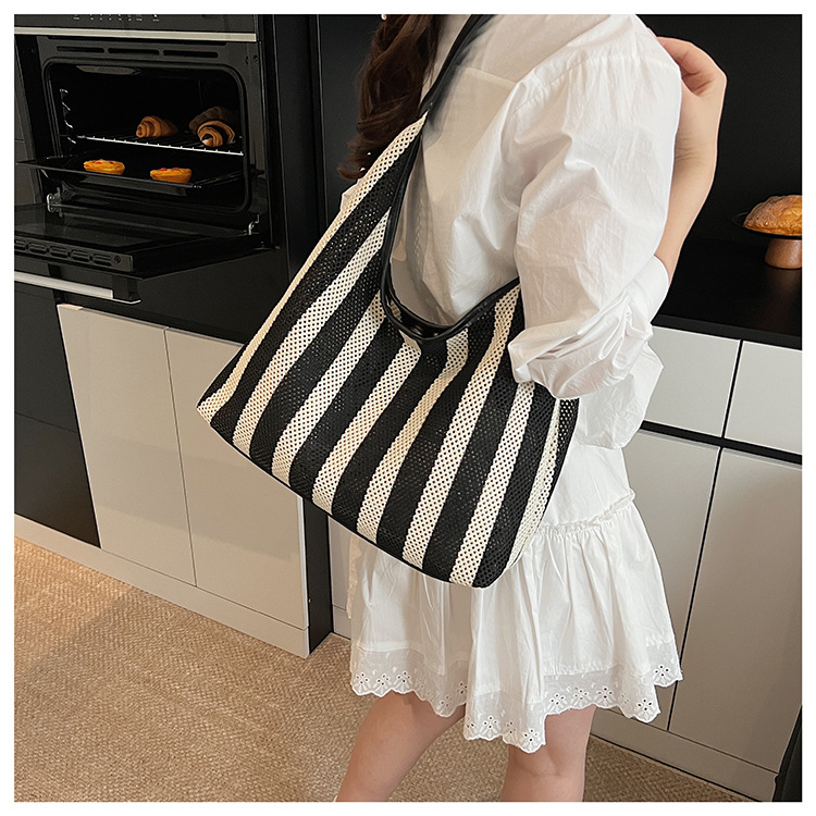 Korean summer new striped woven bag, casual vacation and laid-back style tote bag, hand and shoulder commuter tote bag undefined