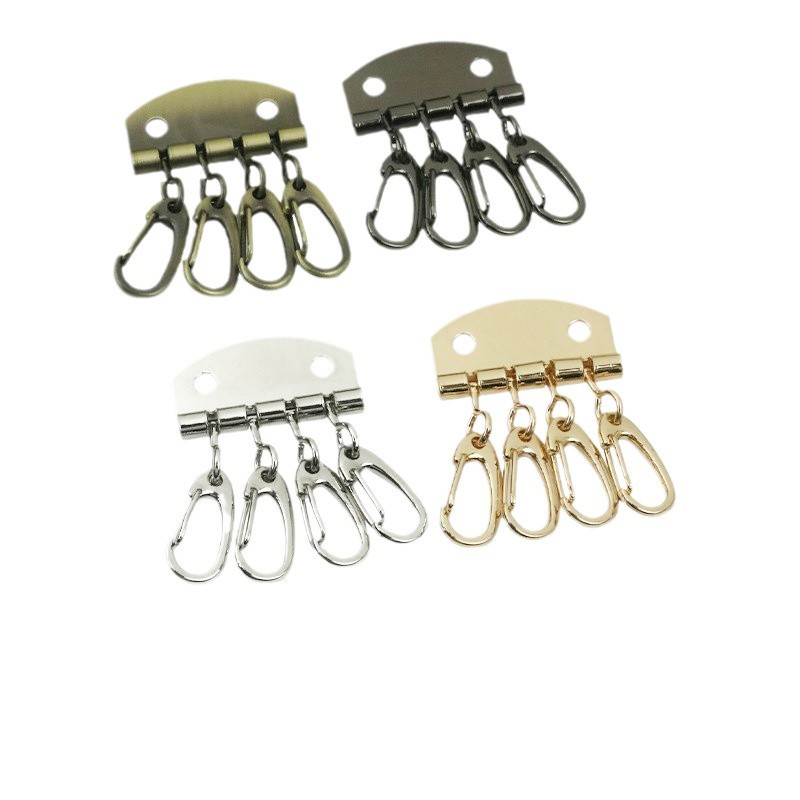 Aleación de zinc de fundición a presión de cuatro dientes clave fila DIY mano de coser clave bolsa de adornos bolsa de cuero accesorios clave de pecho