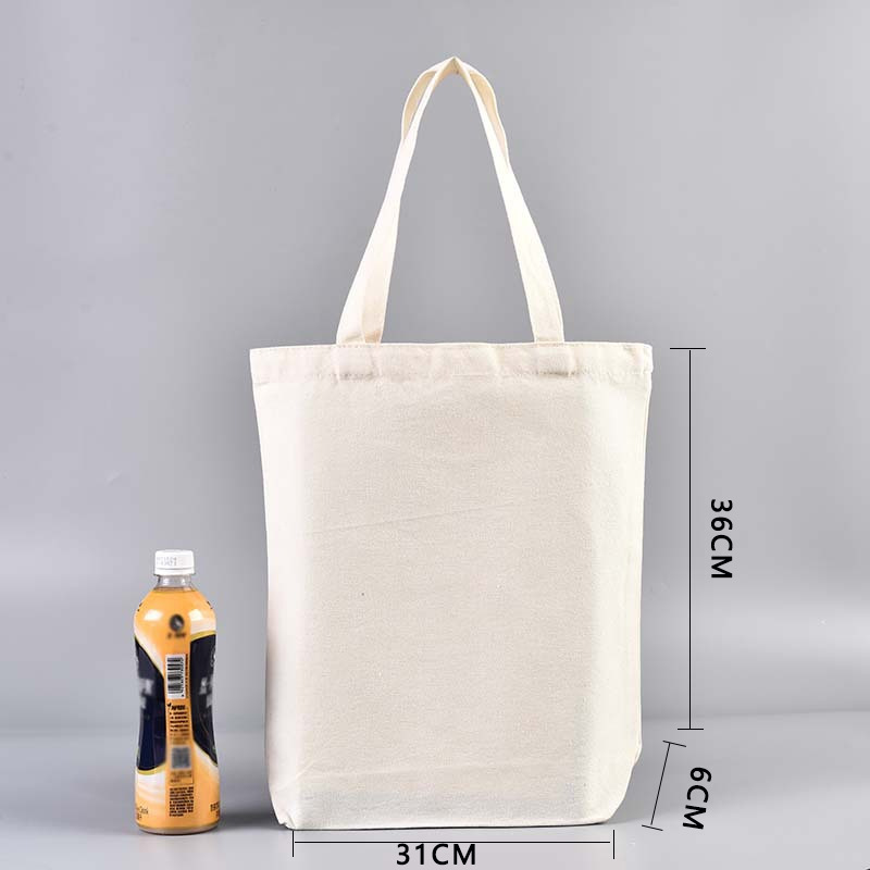 En stock bolsa de lona portátil en blanco personalizable logotipo de impresión en color de un solo hombro bolsa de compras bolsa de algodón de entrenamiento publicitario