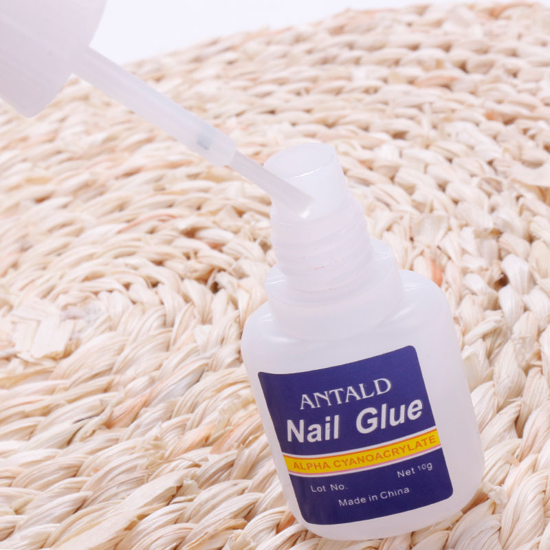 Suministros transfronterizos pegamento de uñas al por mayor 10g botella azul pegamento de uñas con cabeza de cepillo adhesivo de secado rápido pegamento de diamante pegajoso fuerte