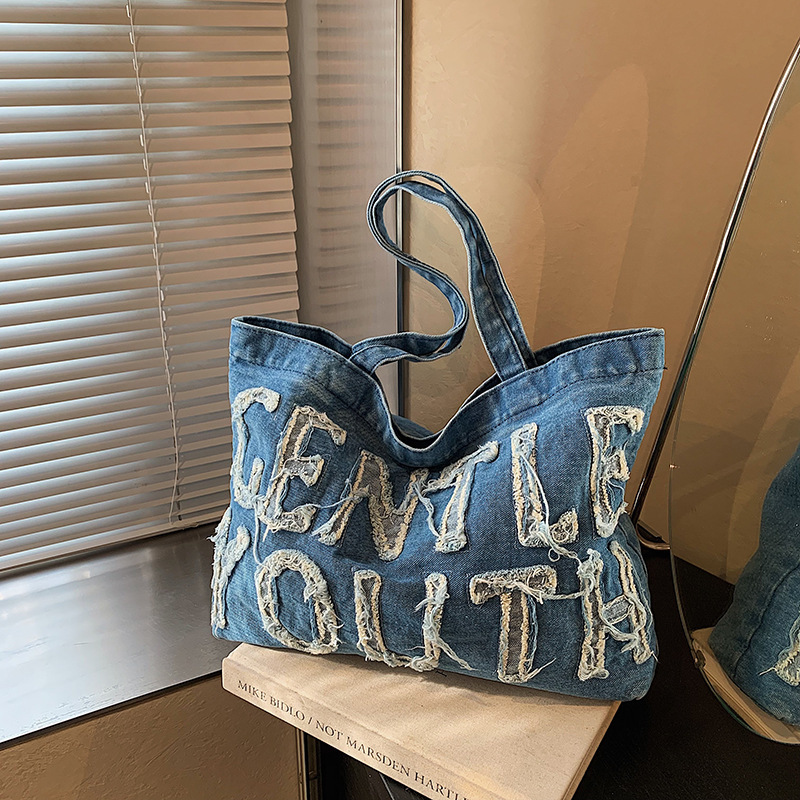 Bolsa de denim de gran capacidad para mujeres 2024 temperamento retro ocio clase de viaje de hombro inclinado bolso inferior