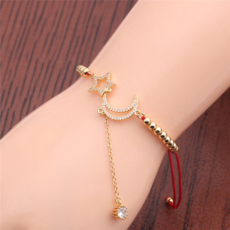 Pulsera Ajustable De Circonitas Doradas Con Luna Y Estrellas display picture 2