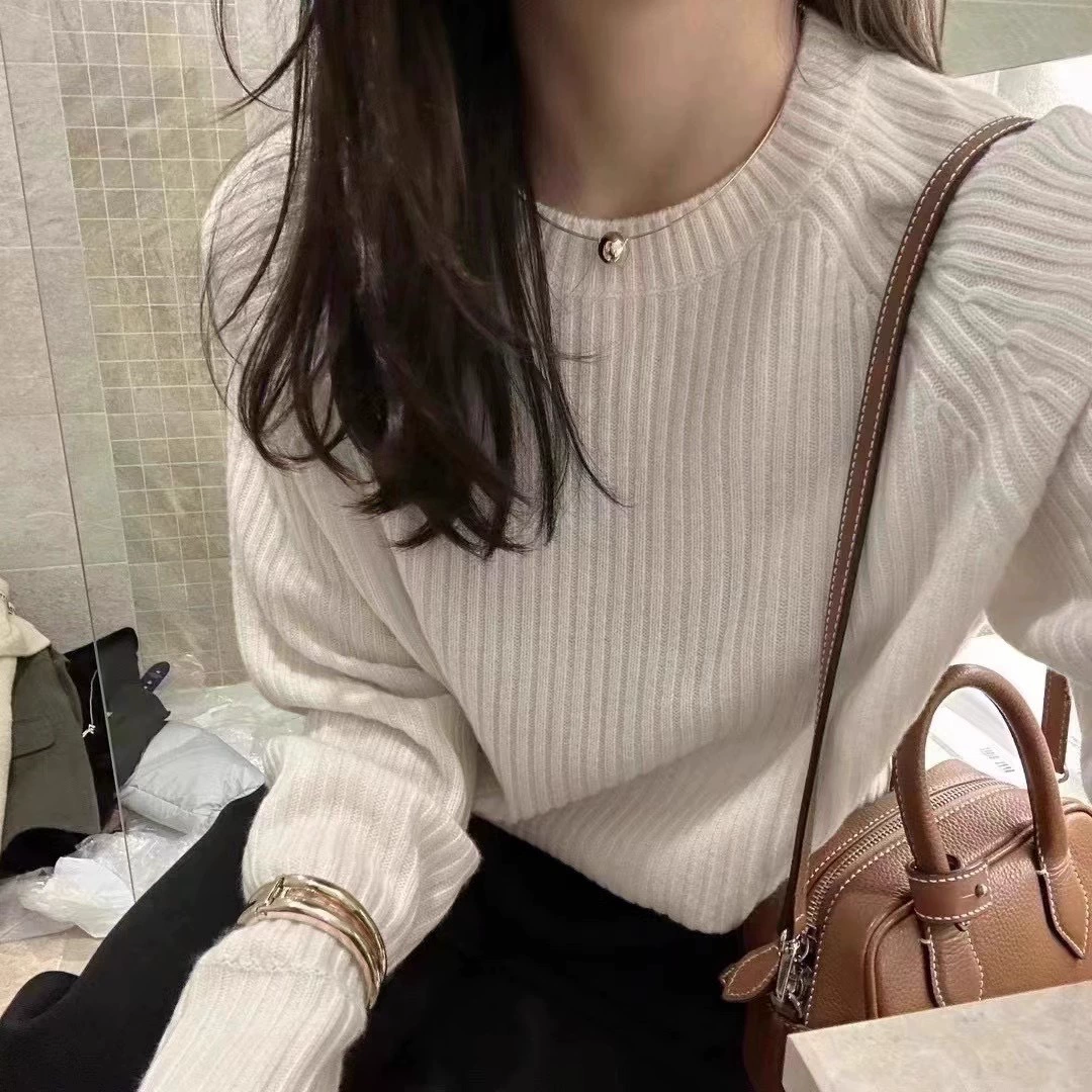 Solid demi-season woolen knitted short sweater with a round collar