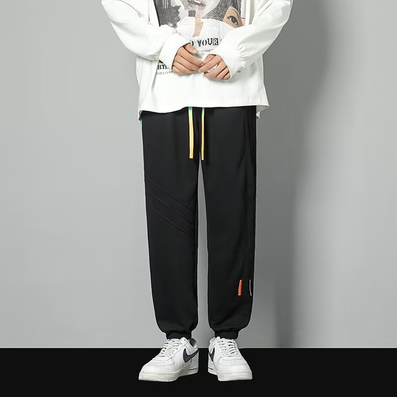 2024 primavera y otoño nuevos pantalones casuales para hombres de moda juvenil marca holgada pantalones deportivos de moda de moda