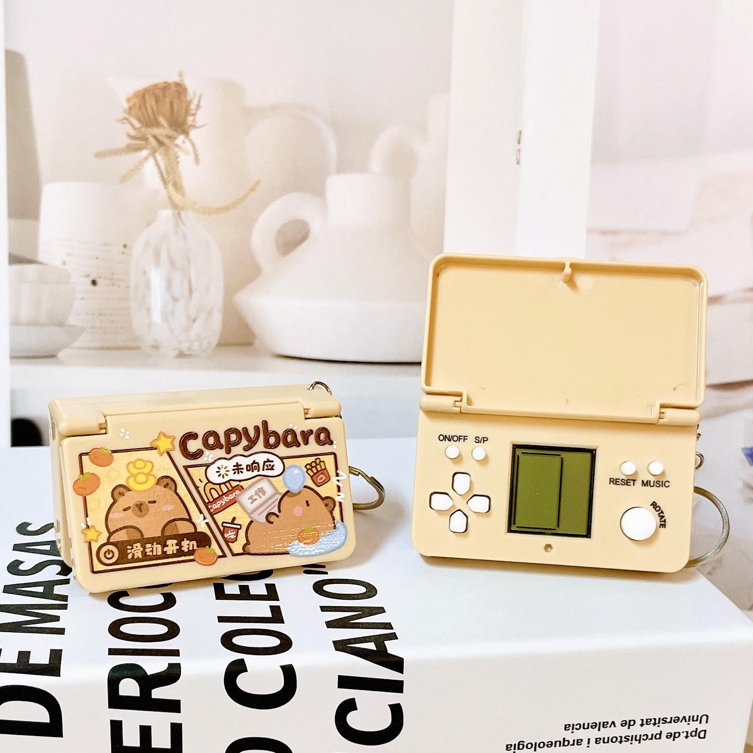 Juegos portátiles creativos de descompresión delfines de agua cámara de proyección llavero tapa de flip bolso de computadora de juegos de computadora colgante