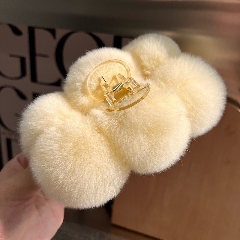 Off-white fur ball