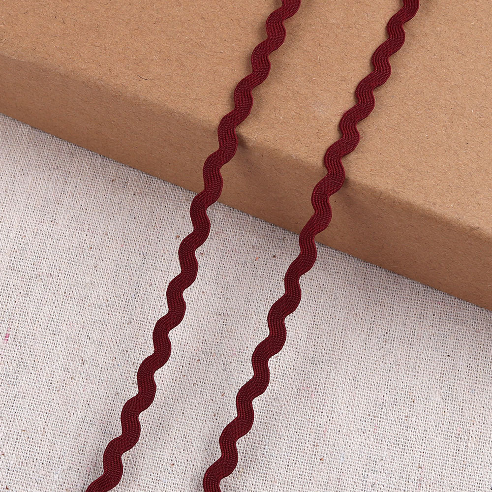 Venta directa de fábrica de polipropileno de color, accesorios de ropa de borde curvo, correas, ondas en forma de cinturón, varios colores