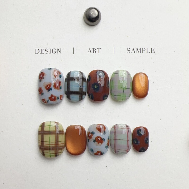 Handmade nail art for autumn and winter, trending on Xiaohongshu and Instagram, featuring glass beads, cat-eye effect, and plaid patterns, available for wholesale Handmade nail art for autumn and winter, trending on Xiaohongshu and Instagram, featuring glass beads, cat-eye effect, and plaid patterns, available for wholesale