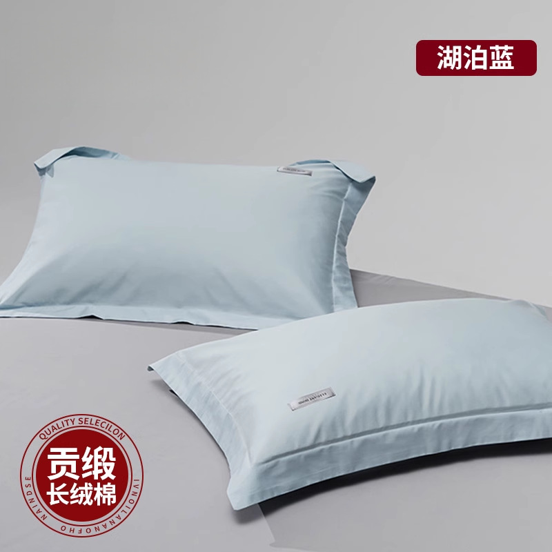 Un par de fundas de almohada de algodón de algodón de fibra larga de satén