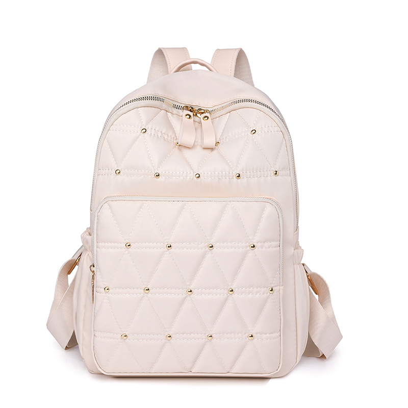 2023 nueva mochila casual para mujer de nailon moda simple y ligera remache mochila de viaje mochila escolar al por mayor