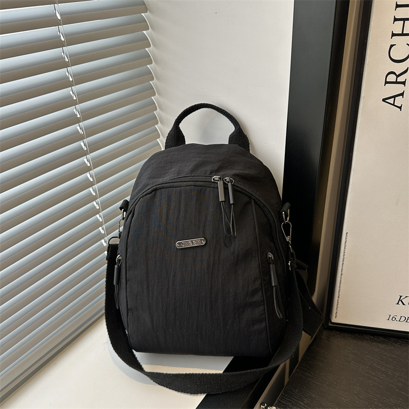 Mochila de verano nueva mochila de viaje de viaje de gran capacidad bolso de hombro de moda todo-fósforo femenino ligero