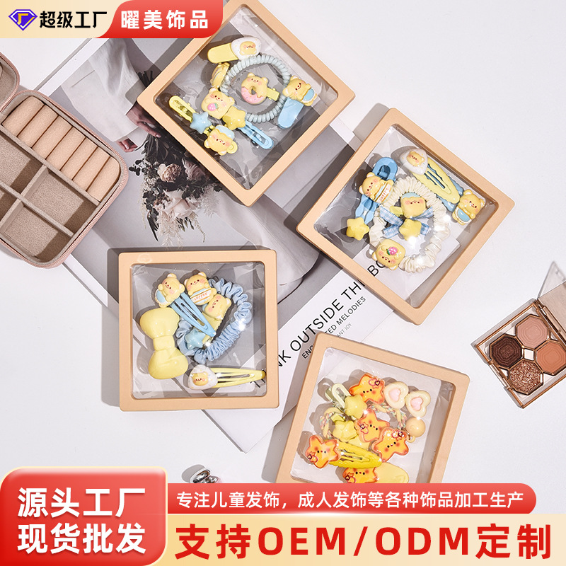 Linda combinación de accesorios para el cabello de la serie de osito amarillo lechoso dulce clip de flequillo de cabello roto de alta elasticidad lazo para el cabello al por mayor