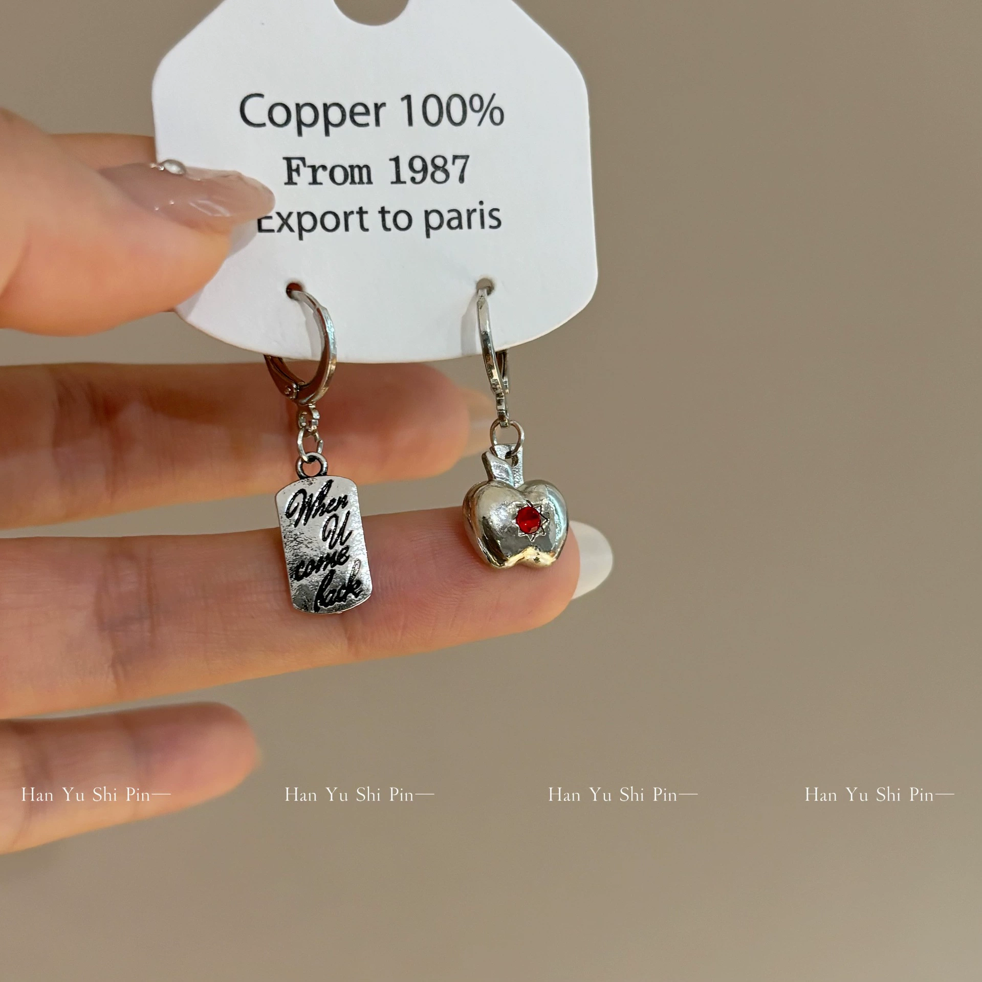 Apple, asymmetrical earrings, simple and elegant design