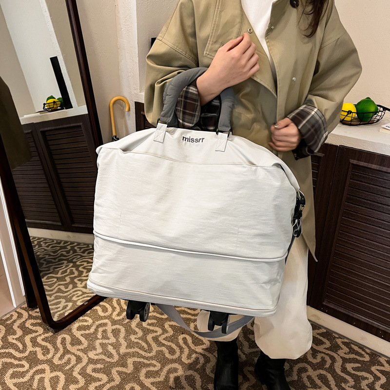 Nueva bolsa de viaje de tela de Oxford con ruedas, bolsa de viaje corto de gran capacidad, bolsa de almacenamiento para hombres, bolsa de embarque de viaje