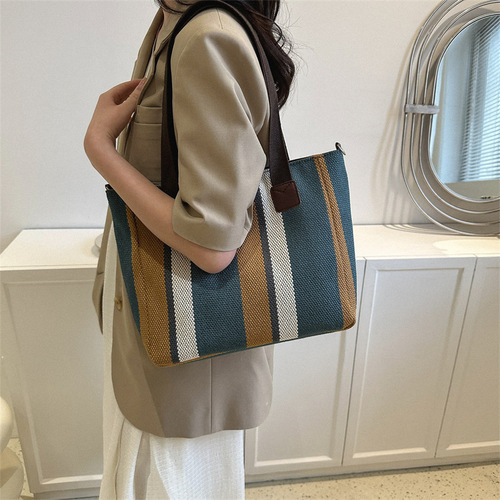 Trendy large-capacity striped canvas bag for women  new fashion commuter handheld tote bag single shoulder crossbody bag
