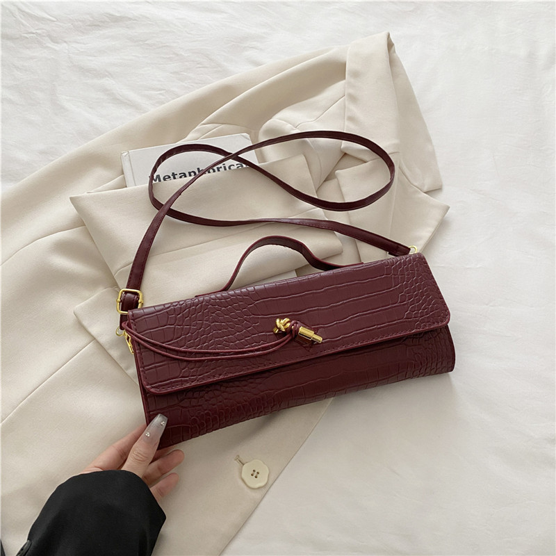 2025 verano temperamento tendencia nuevo temperamento bolso de palo francés con bloqueo diagonal bolso horizontal bolso de mensajero de un solo hombro bolso femenino
