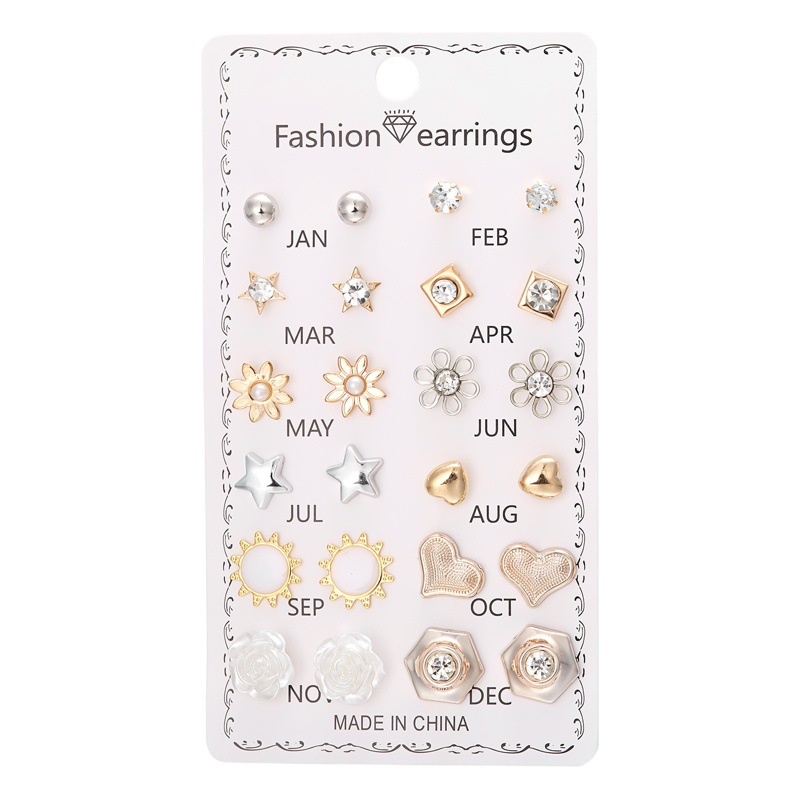 Set de 12 pares de aretes con flores de diamante