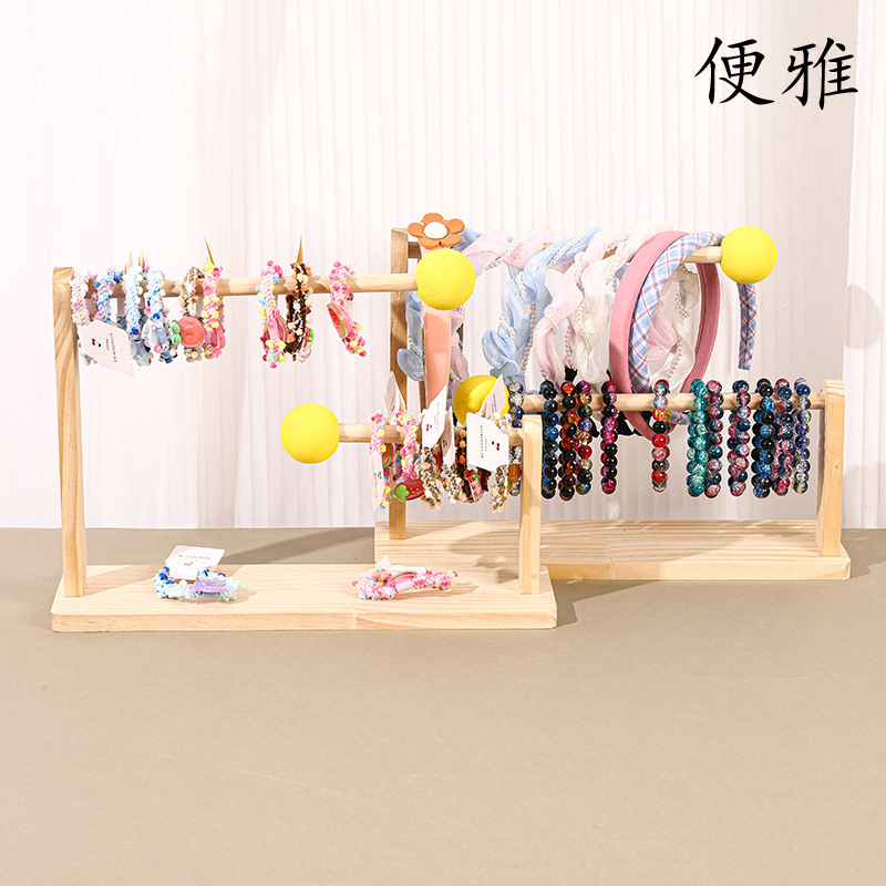 現品の実木のアクセサリーの棚のひもの頭の花の収納棚のカチューシャの髪のアクセサリーの陳列棚のブレスレットのブレスレットのハンガー|undefined