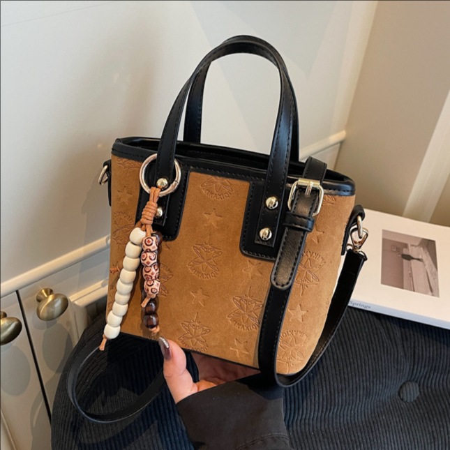 Popularidad transfronteriza retro bolso de cubo portátil para mujeres otoño / invierno 2025 nueva moda versátil bolso de hombro simple mochila